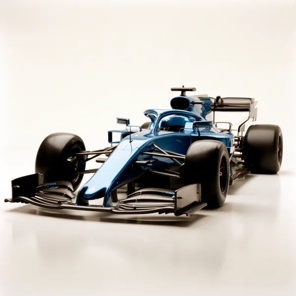 A blue Formula One race car with aerodynamic design against a white background under studio lighting.