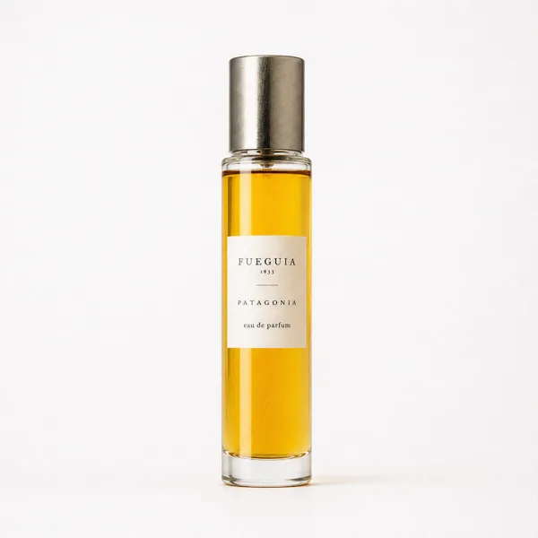 A perfume bottle with a metallic cap and golden liquid, set against a white background with soft lighting.